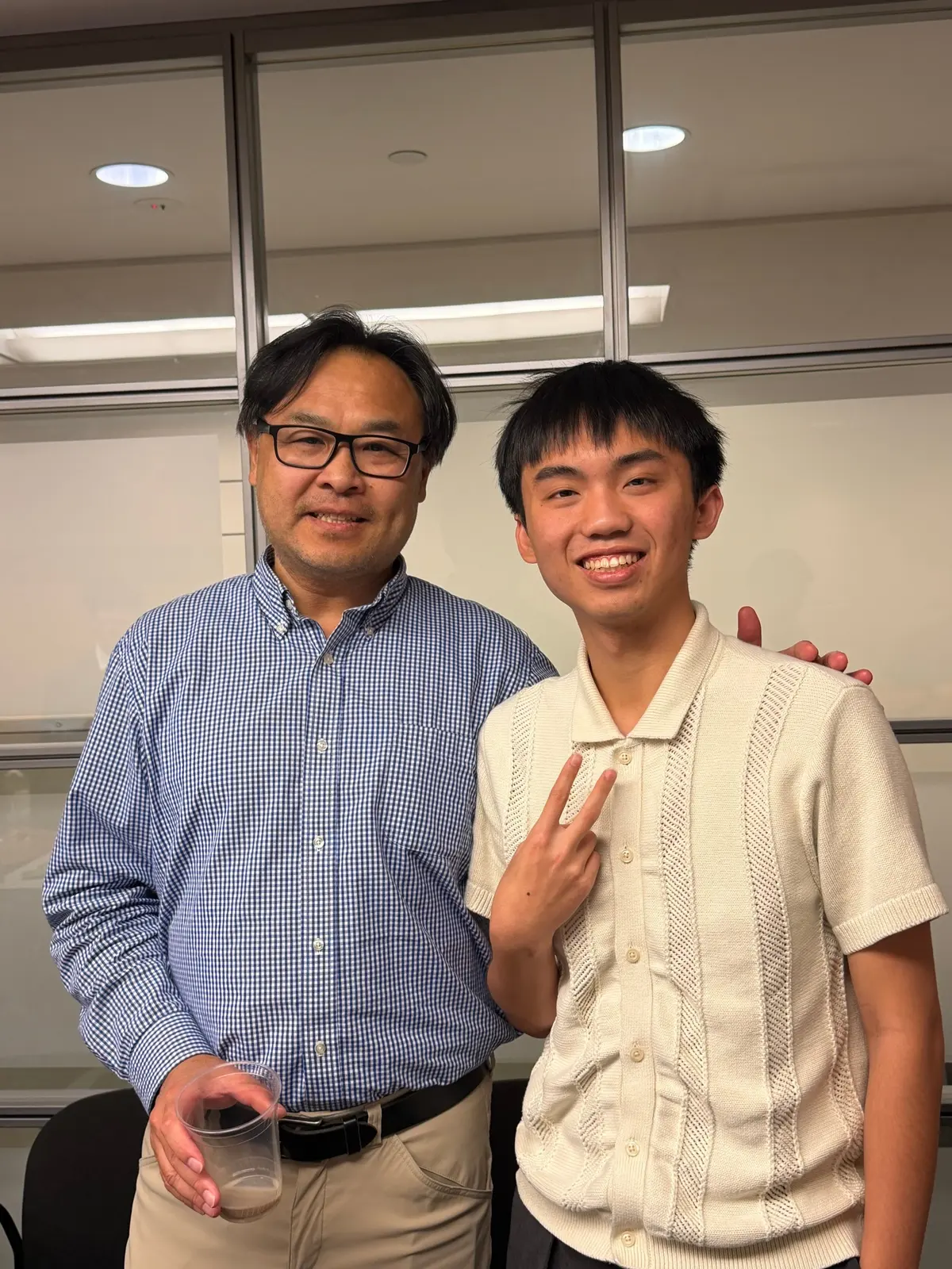 Alen Hsiao with another person, smiling.
